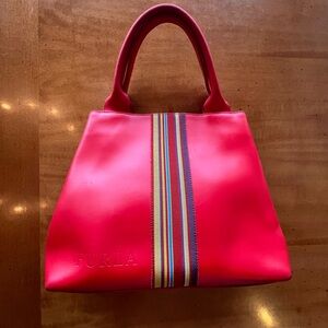 Furla red shoulder bag with rainbow ribbon stripe detail and embossed logo.